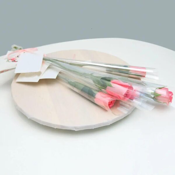 single stem light pink rose wrapped