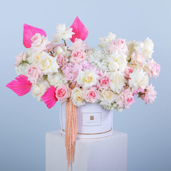 Luxury flower box featuring white hydrangeas, pink ohara roses, and dry leaves