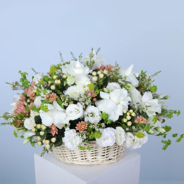 A stunning collection of white blooms arranged in a basket, showing the elegance and allure of flowers.