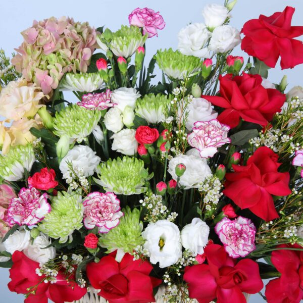 Elegant fresh flowers beautifully arranged in a stylish basket.