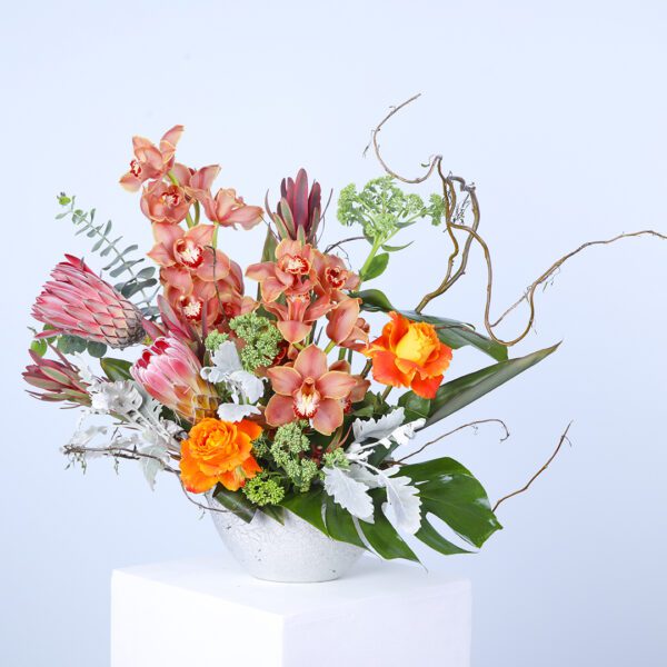 Mixed flowers vase featuring a delightful assortment of vibrant blooms for a charming home decor touch.