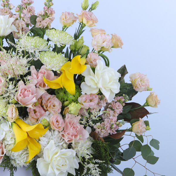 A beautiful flower box with a variety of flowers that change with the seasons.