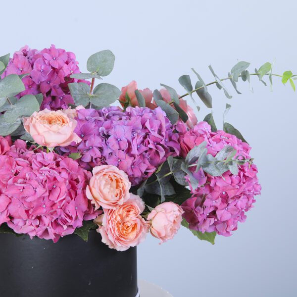 A sophisticated floral arrangement perfect for a glamorous evening event.