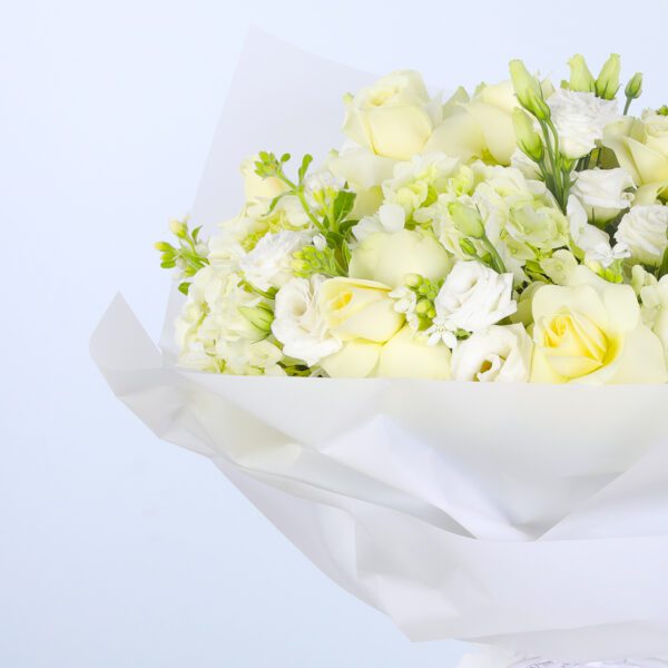 Graceful white blooms in a sleek white wrap, creating a timeless arrangement.