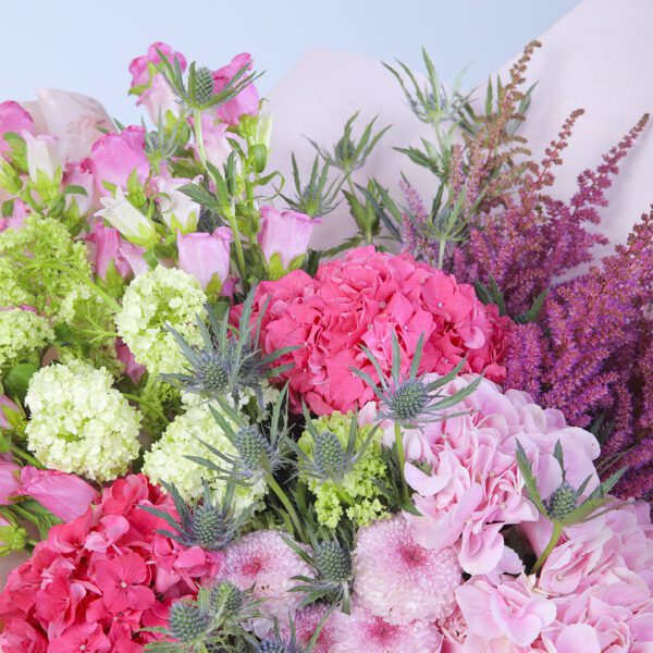 A kaleidoscope of colors, expertly arranged into a stunning mixed bouquet.