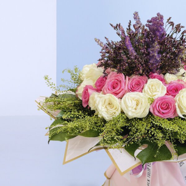 Sophisticated floral design featuring roses in soft hues, ideal for gifting or home decor.